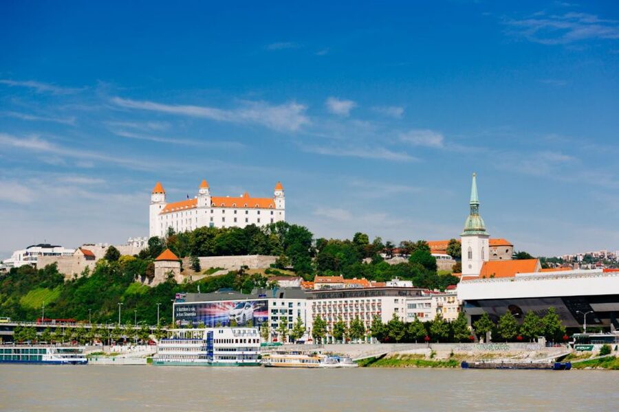 From Vienna: Guided Tour to Bratislava with Speed Boat Ride - Bratislava old town walking tour: gates, churches, and an easy overview