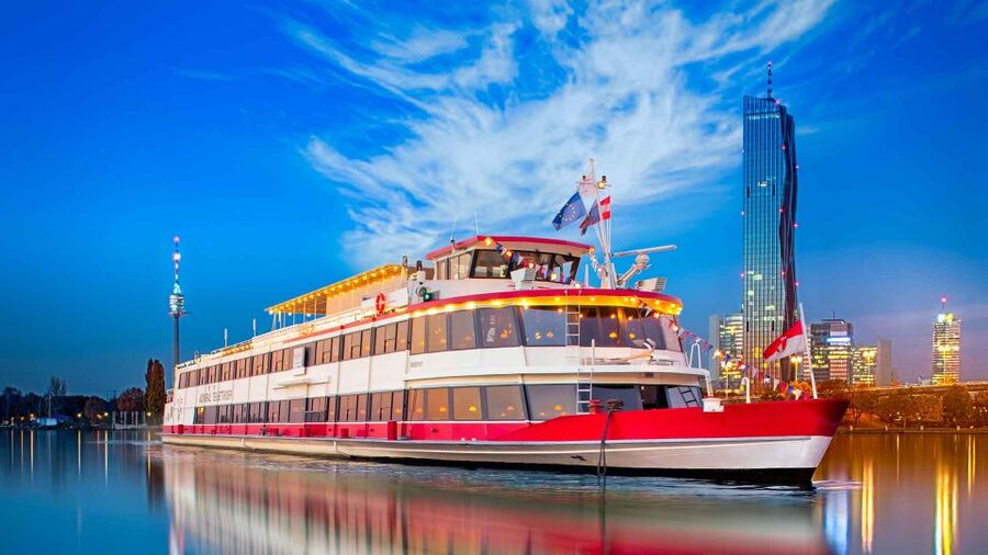 Vienna: 3,5-Hour Danube Cruise "Greek Night" - Getting onto the Danube: Reichsbrücke and the Greek-night atmosphere